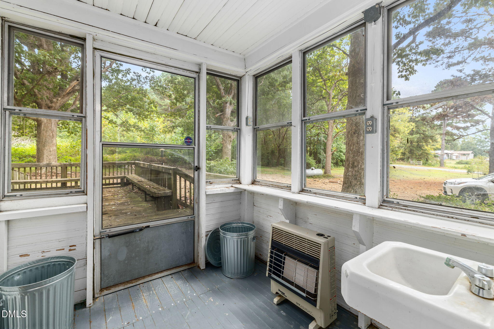 1089 Gillburg Road Henderson, NC 27537 - Photo 14 of 32 a bathroom with a sink and a bathtub