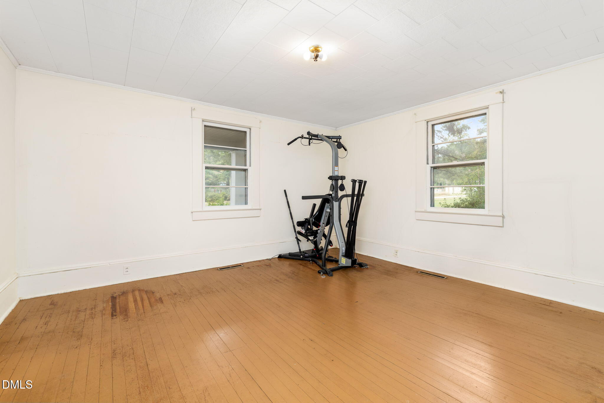 1089 Gillburg Road Henderson, NC 27537 - Photo 15 of 32 a view of an empty room with windows