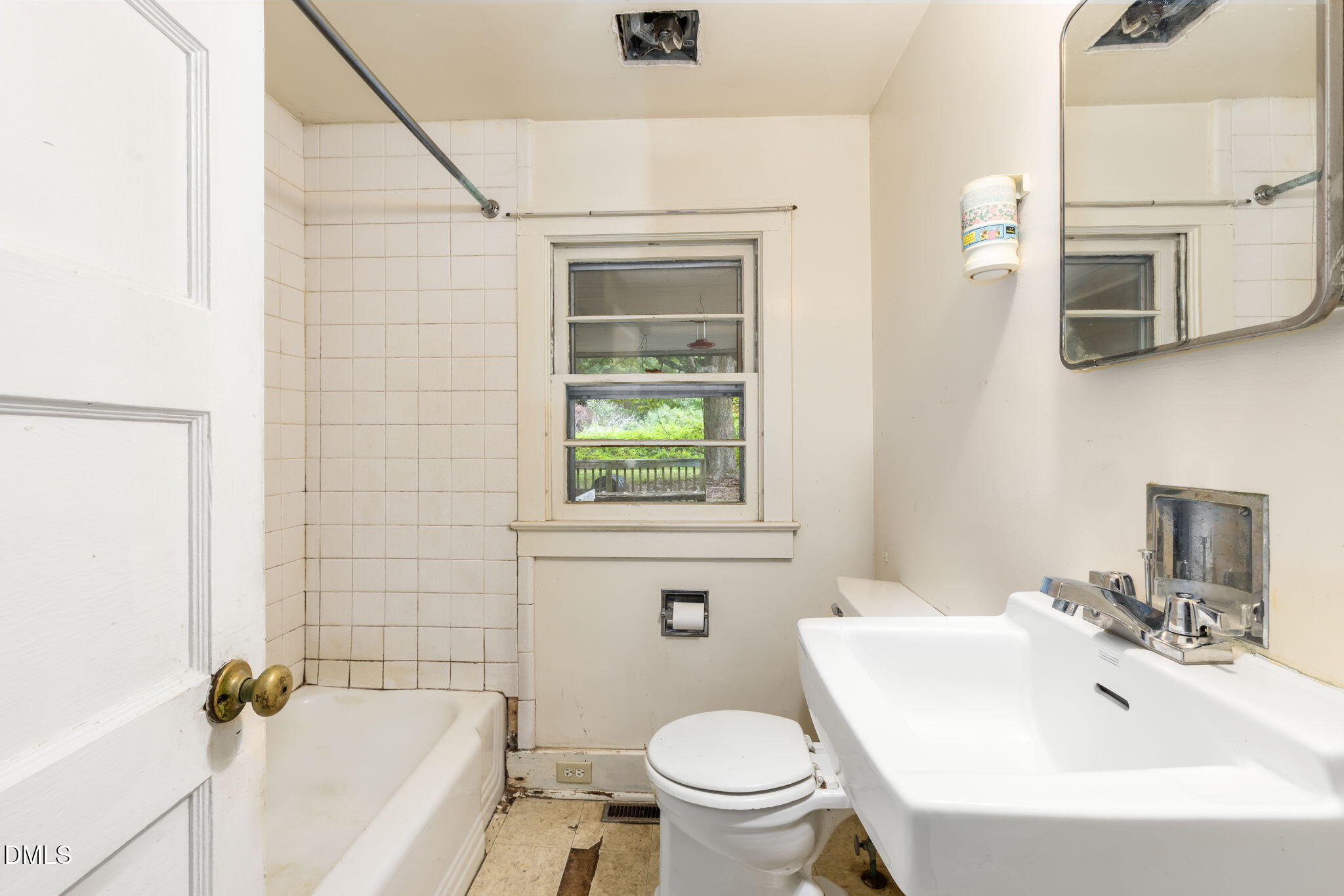 1089 Gillburg Road Henderson, NC 27537 - Photo 17 of 32 a bathroom with a sink toilet and shower
