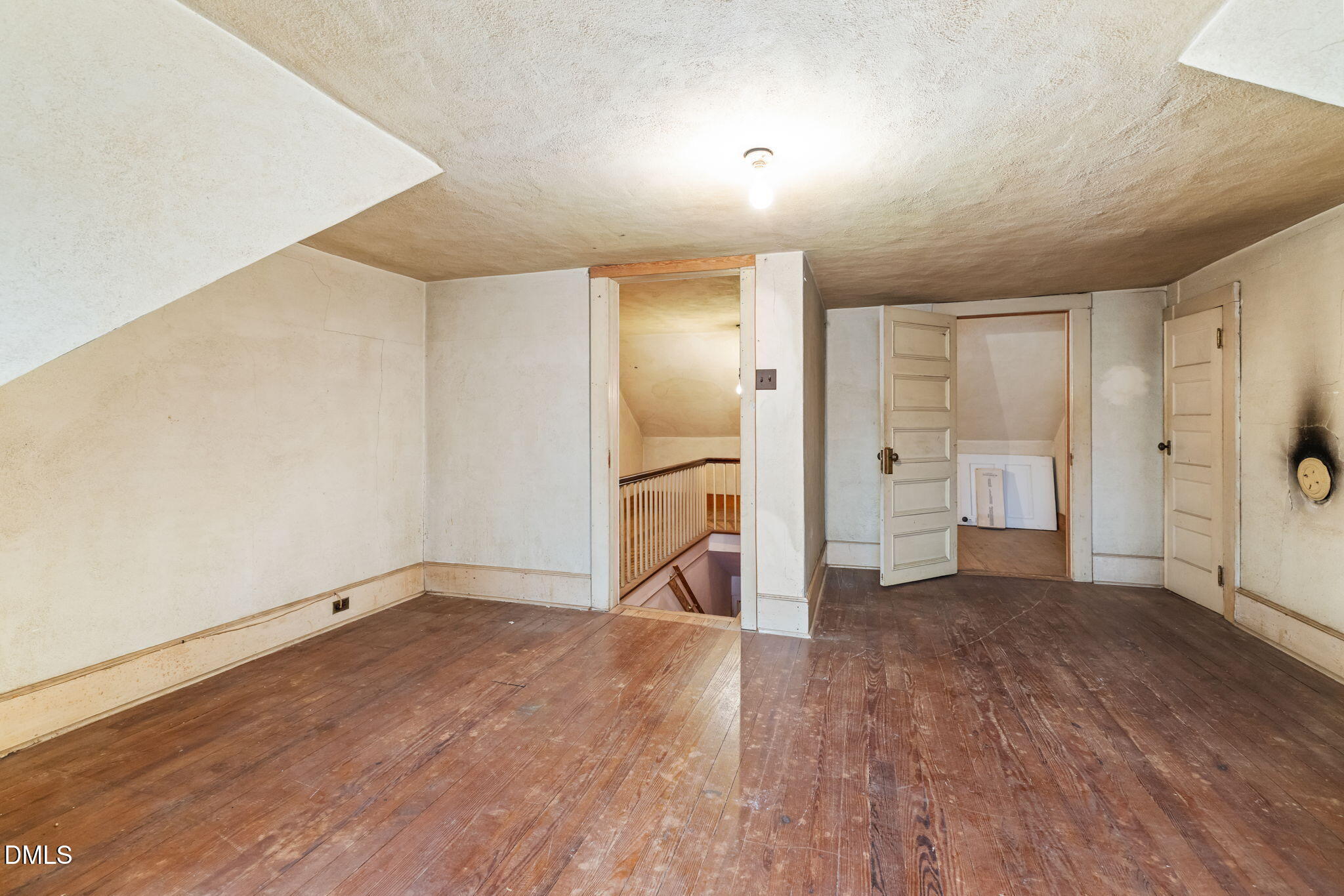 1089 Gillburg Road Henderson, NC 27537 - Photo 23 of 32 wooden floor in an empty room with an entrance