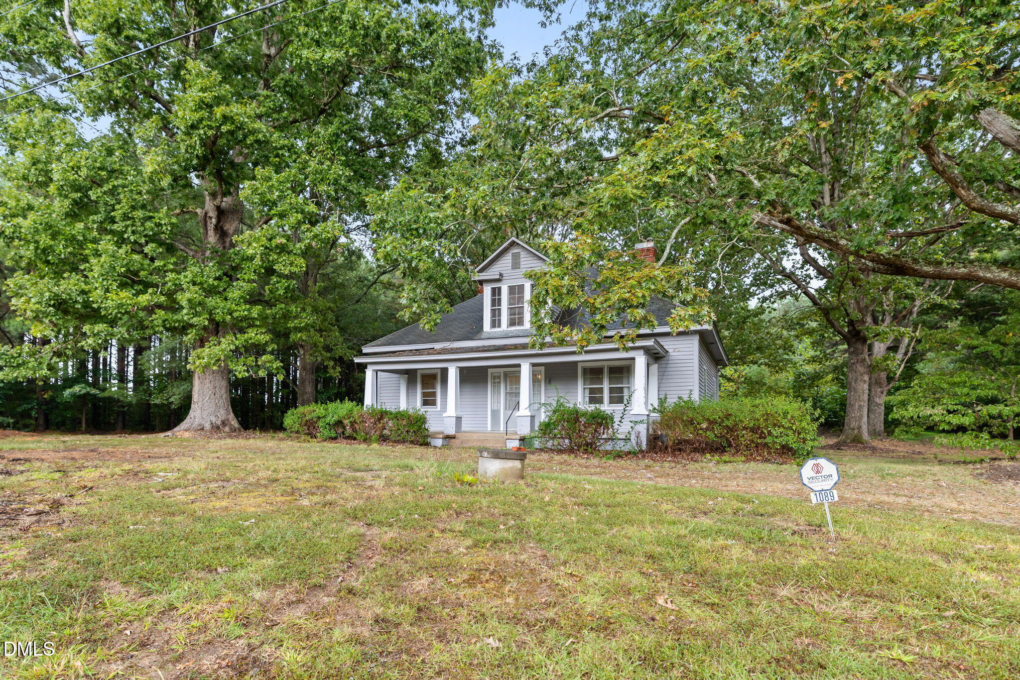 1089 Gillburg Road Henderson, NC 27537 - Photo 25 of 32 a front view of a house with a garden