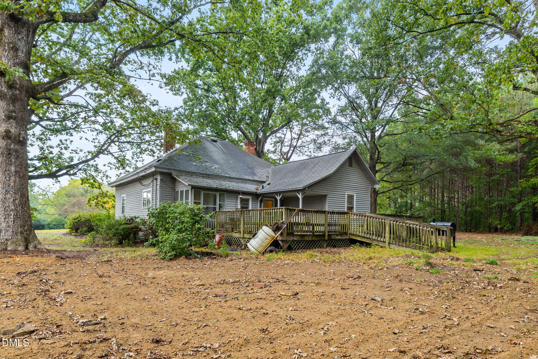 1089 Gillburg Road Henderson, NC 27537 - Photo 2 of 32 a front view of a house with garden