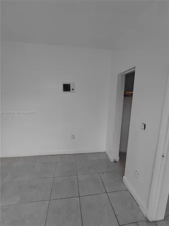 an empty room with a bench