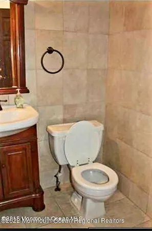 a kitchen with a table chairs and a refrigerator