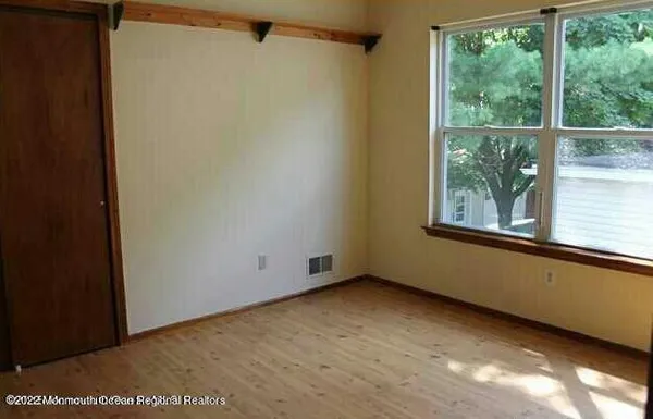 a bathroom with a toilet a sink and a mirror