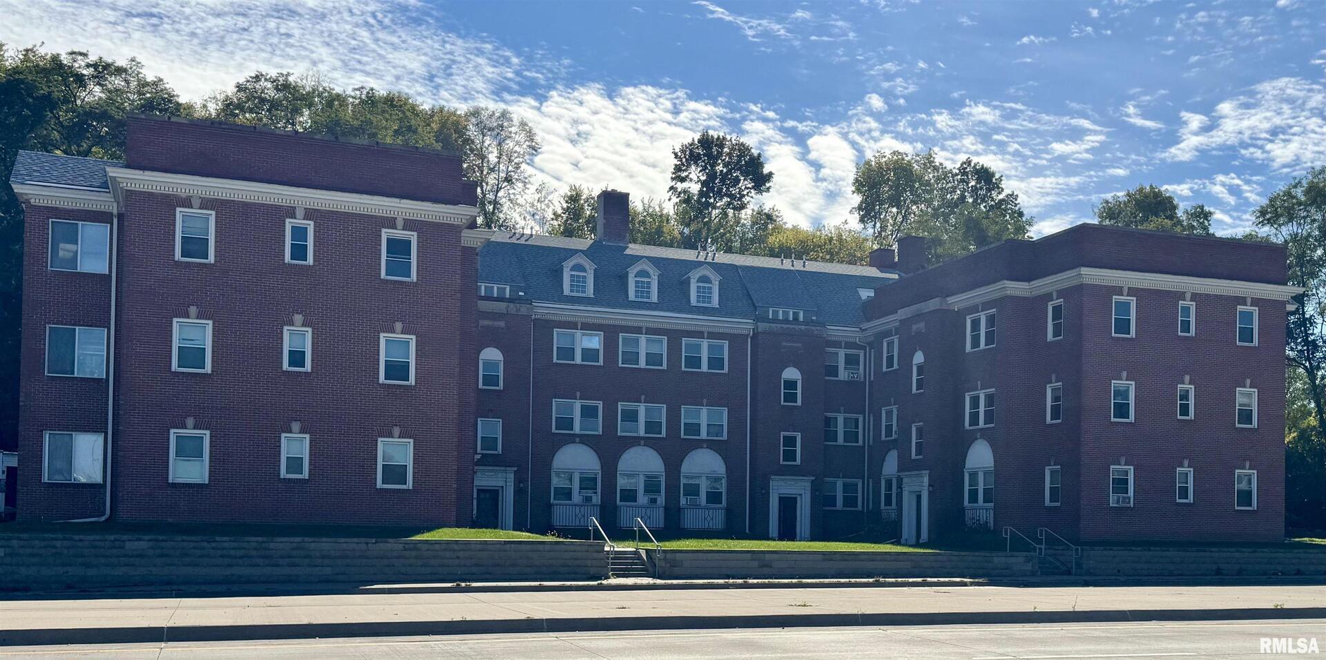 2028 7th Avenue, Unit D1 Moline, IL 61265 - Photo 1 of 9 a front view of a building with garden