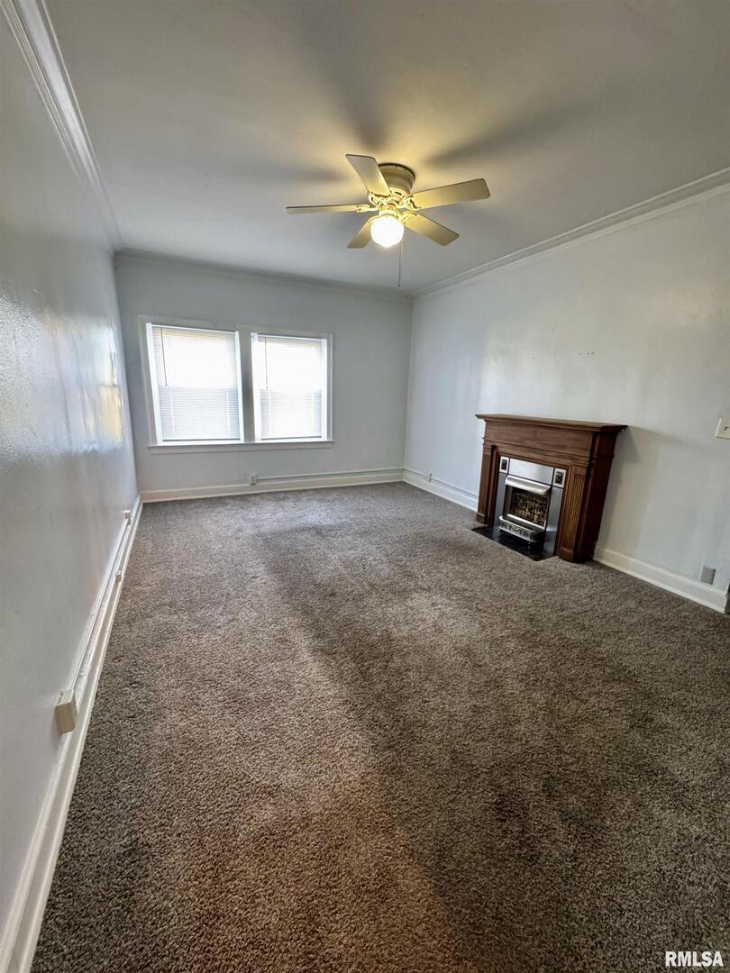 2028 7th Avenue, Unit D1 Moline, IL 61265 - Photo 4 of 9 a view of an empty room with a window