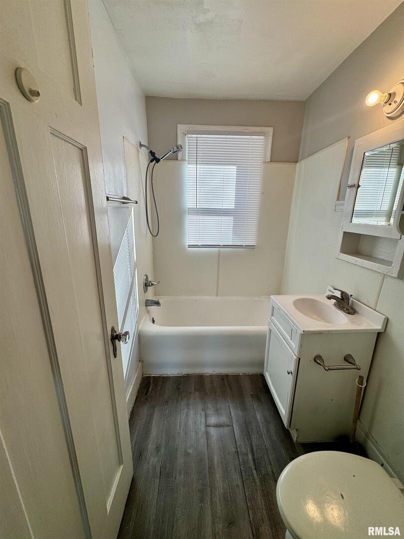 2028 7th Avenue, Unit D1 Moline, IL 61265 - Photo 6 of 9 a bathroom with a sink toilet and shower
