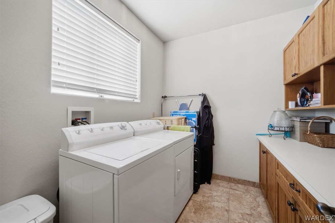 1084 Dike Road Mohave Valley, AZ 86440 - Photo 56 of 75 a utility room with cabinets washer and dryer
