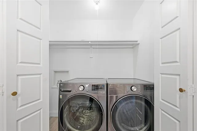 a view of storage and utility room with washer and dryer