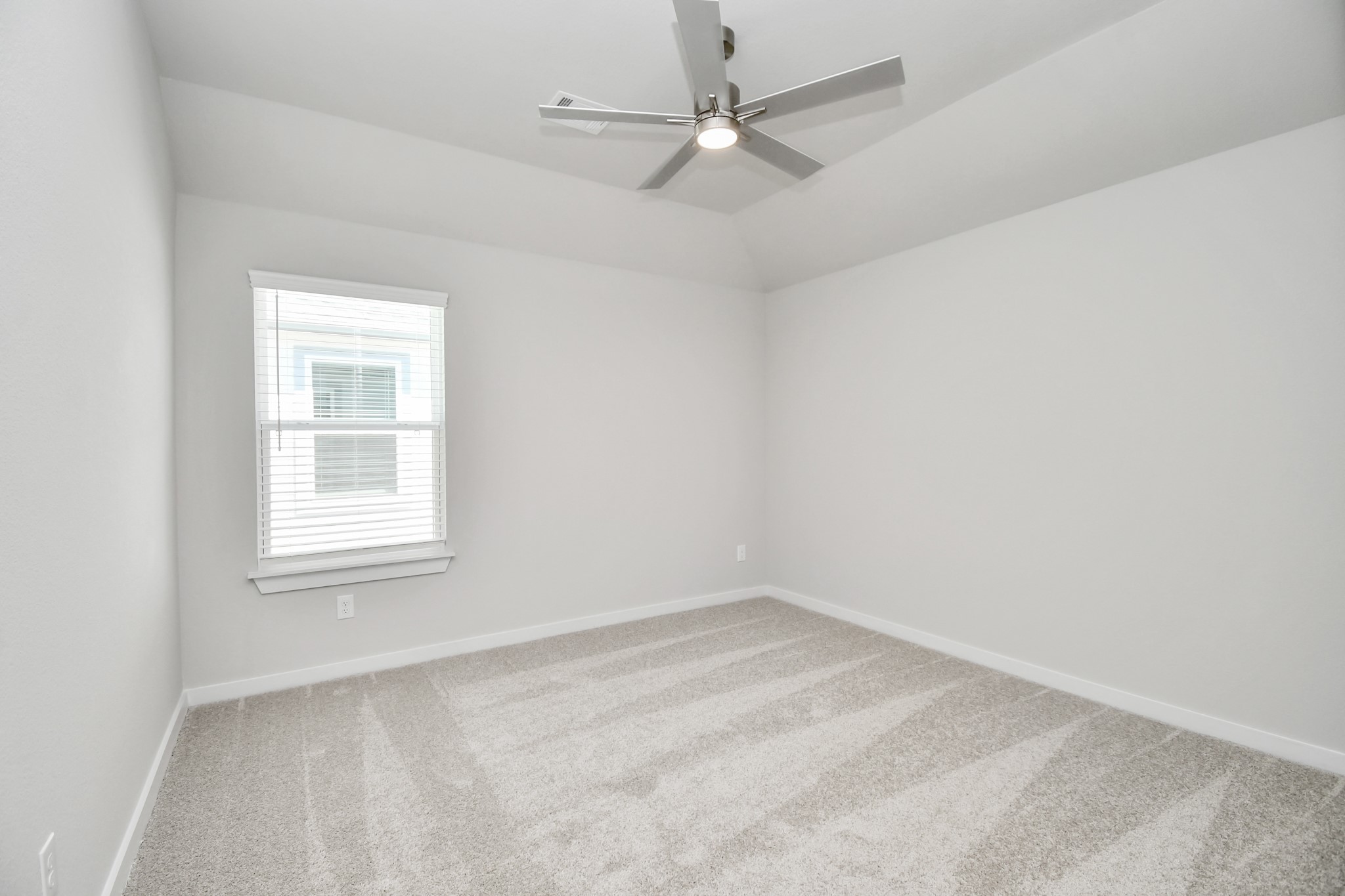 3038 Native Spg Drive Spring, TX 77373 - Photo 34 of 40 Secondary bedroom features plush carpeting, large windows that let in plenty of natural light, bright paint, and spacious closets. Sample photo of completed home with similar floor plan. Actual colors and selections may vary.