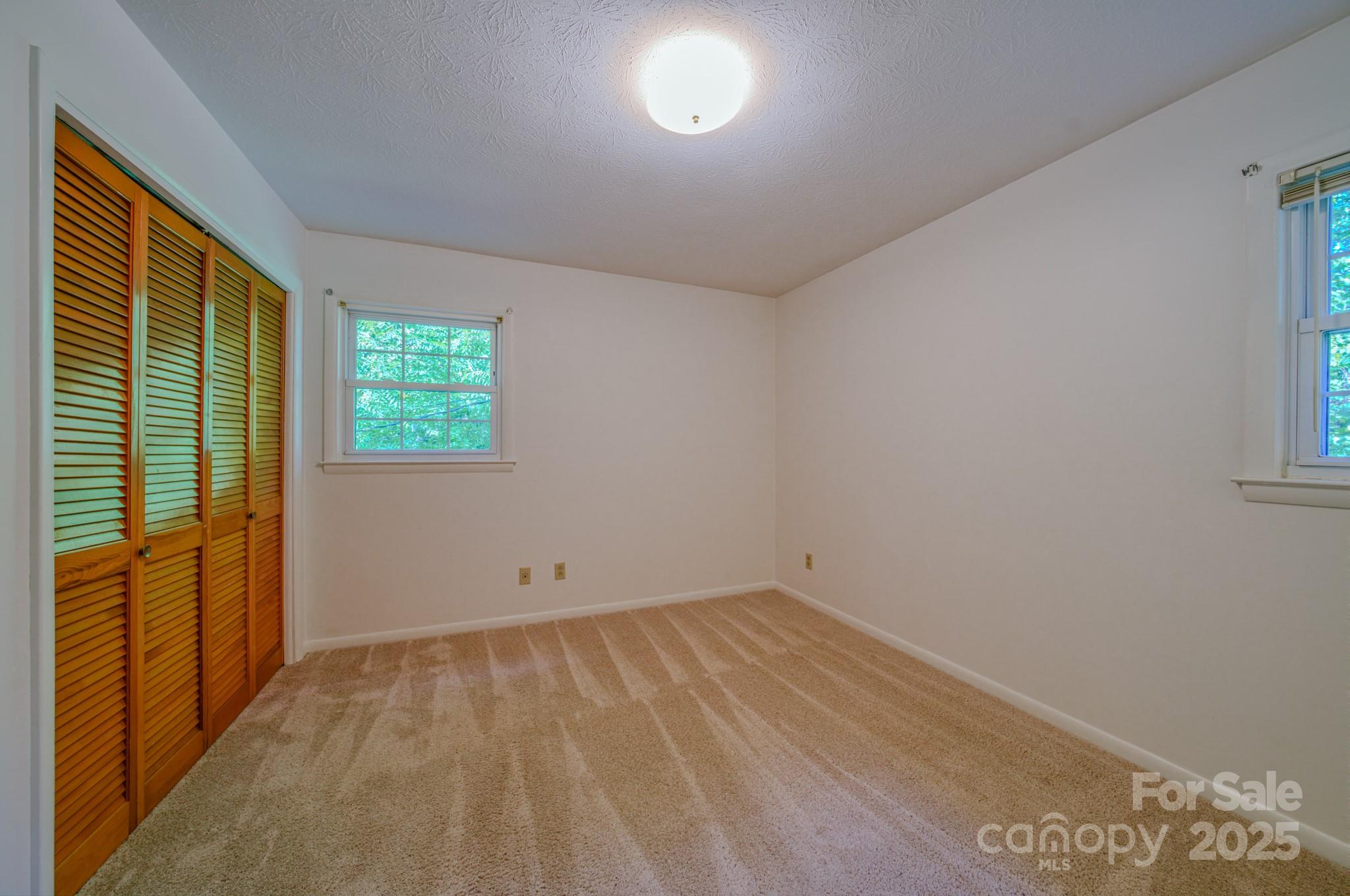 31 Jupiter Road Weaverville, NC 28787 - Photo 18 of 43 an empty room with a window
