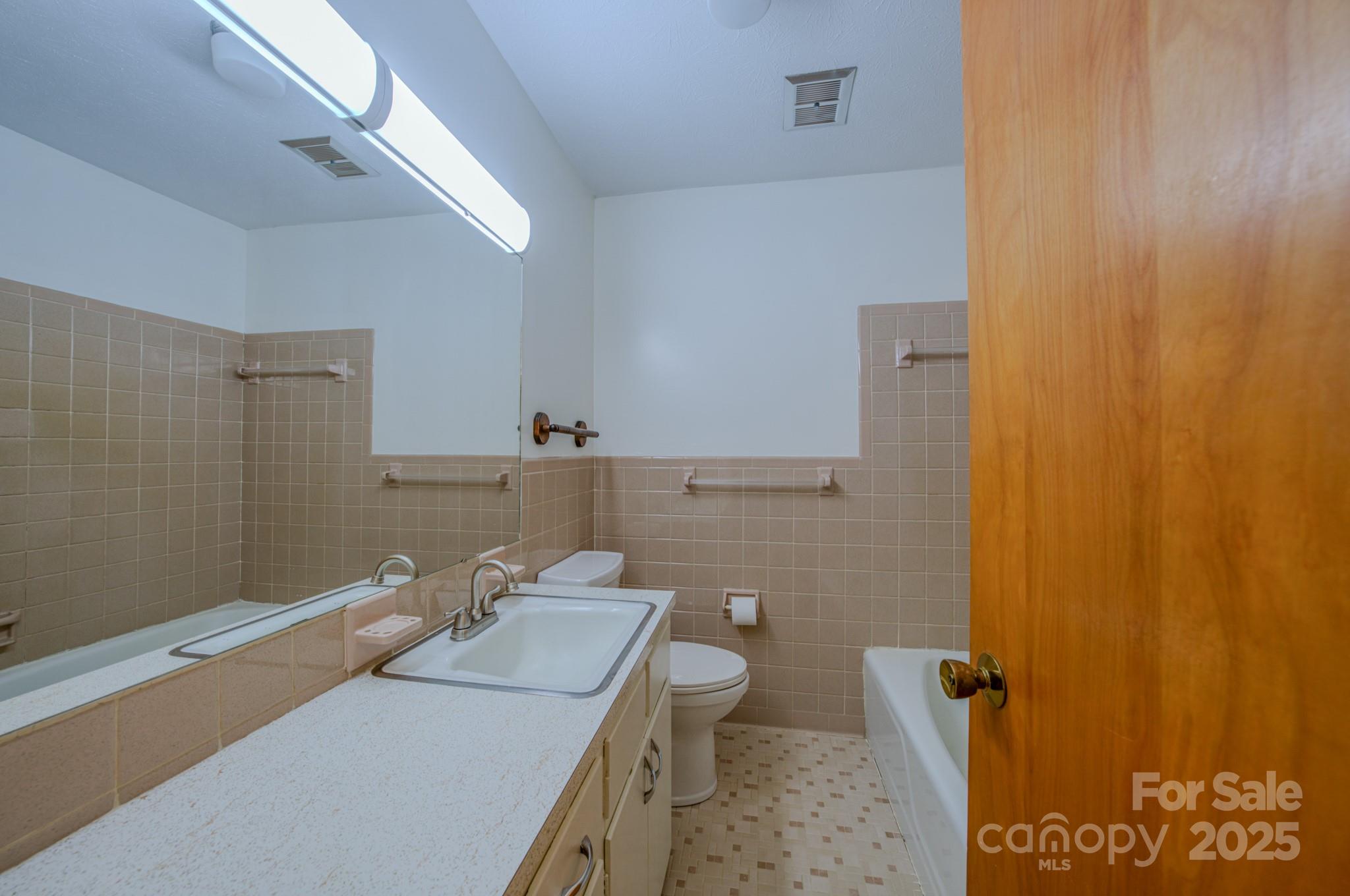 31 Jupiter Road Weaverville, NC 28787 - Photo 23 of 43 a bathroom with a sink and a toilet