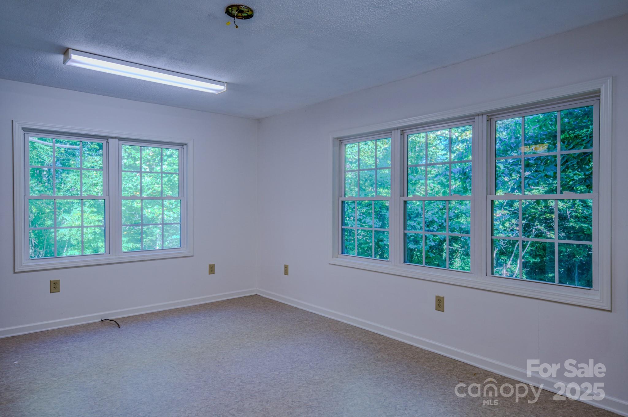 31 Jupiter Road Weaverville, NC 28787 - Photo 27 of 43 an empty room with a window