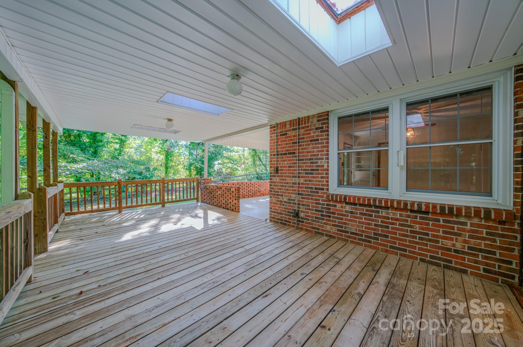 31 Jupiter Road Weaverville, NC 28787 - Photo 28 of 43 a porch with wooden floor
