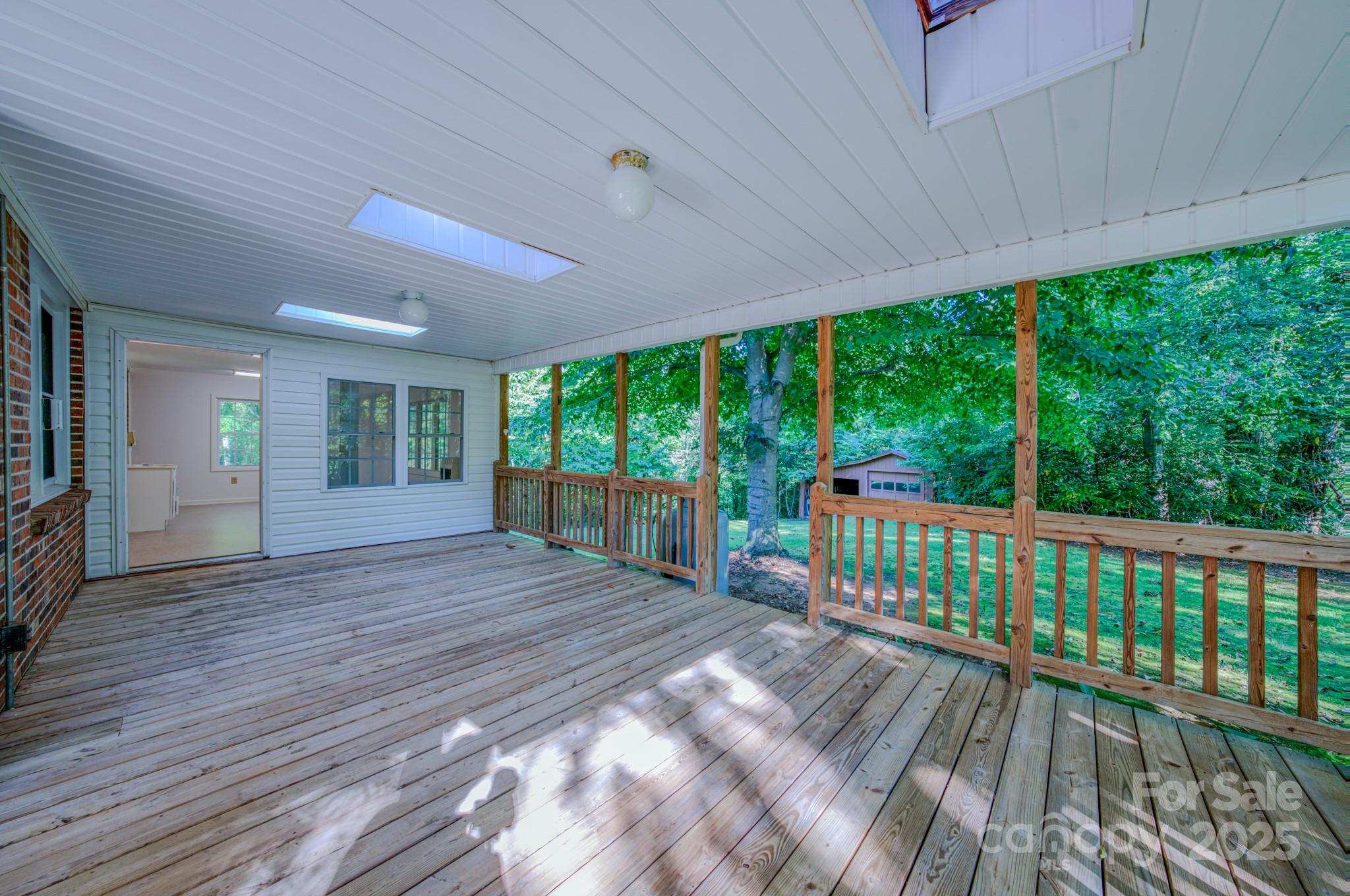 31 Jupiter Road Weaverville, NC 28787 - Photo 30 of 43 a view of a porch with wooden floor and outdoor space