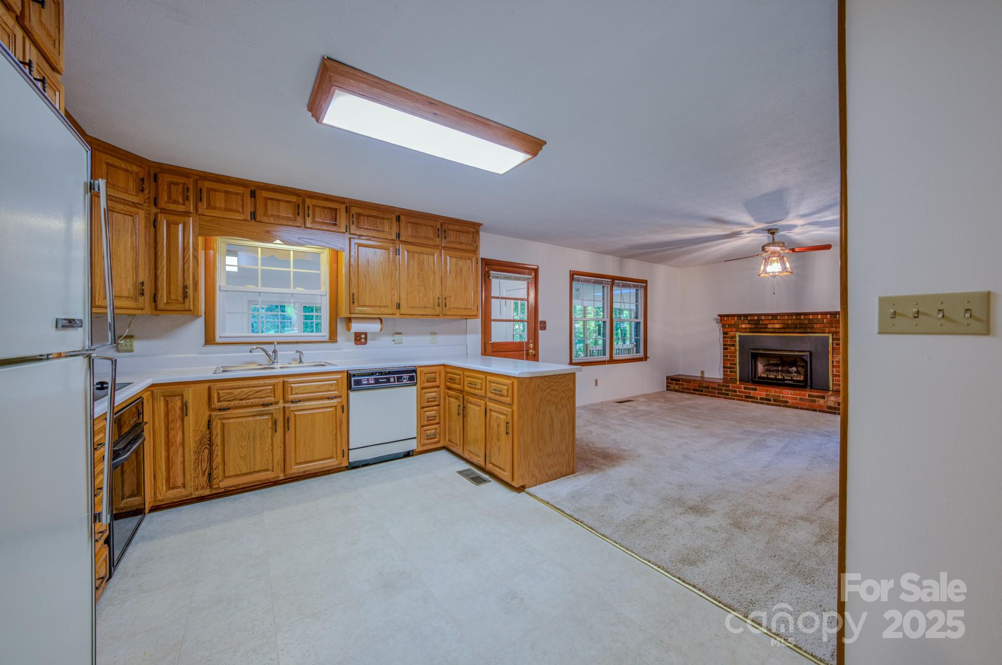 31 Jupiter Road Weaverville, NC 28787 - Photo 6 of 43 a large kitchen with a large window and stainless steel appliances
