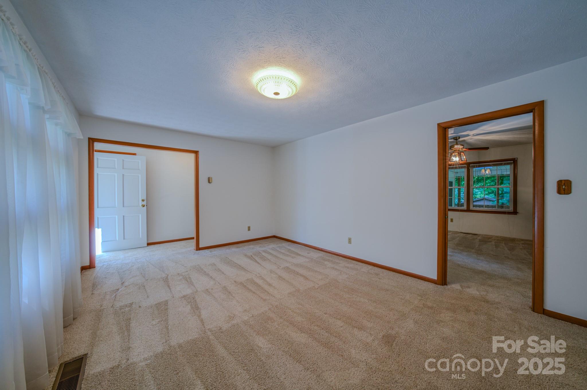 31 Jupiter Road Weaverville, NC 28787 - Photo 8 of 43 a view of an empty room and a window