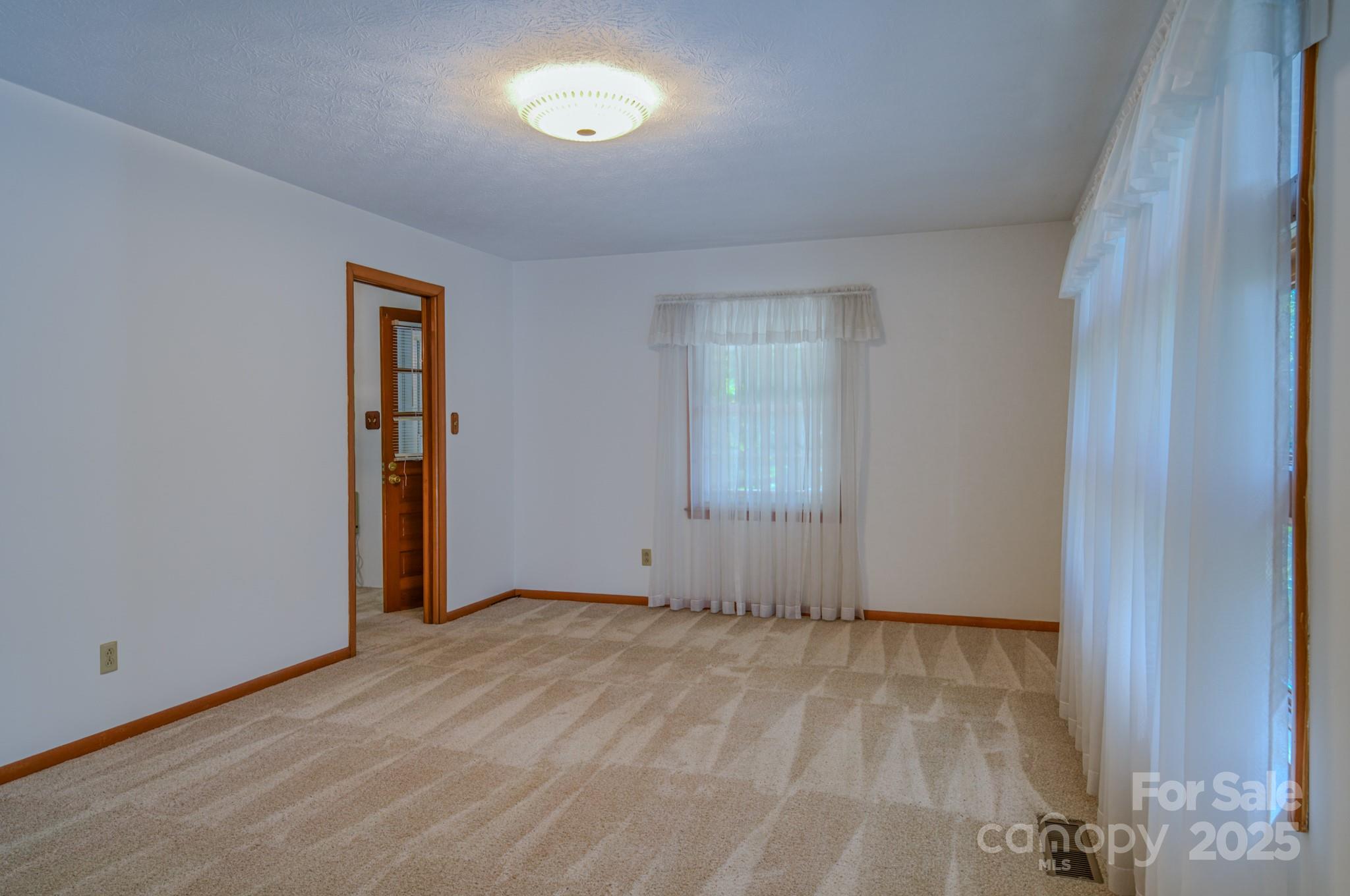 31 Jupiter Road Weaverville, NC 28787 - Photo 9 of 43 an empty room with a natural light