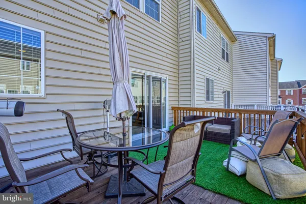 a view of an house with backyard and patio