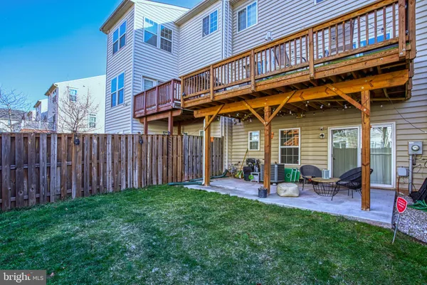 a view of a house with wooden fence