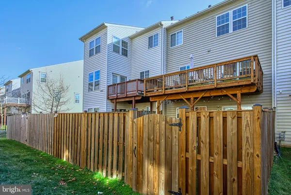 a view of a house with wooden deck