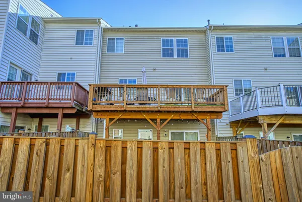 a view of a house with wooden deck