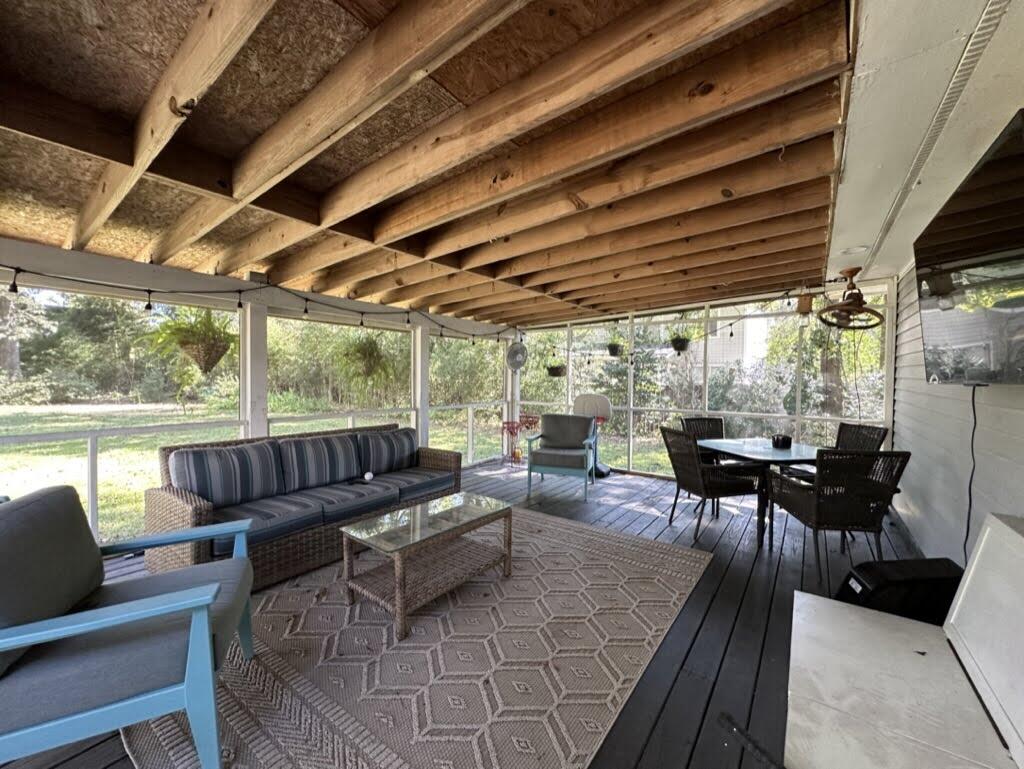 238 Howle Avenue Charleston, SC 29412 - Photo 31 of 38 Screen Porch with furniture