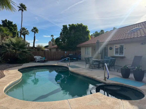 a view of a house with swimming pool