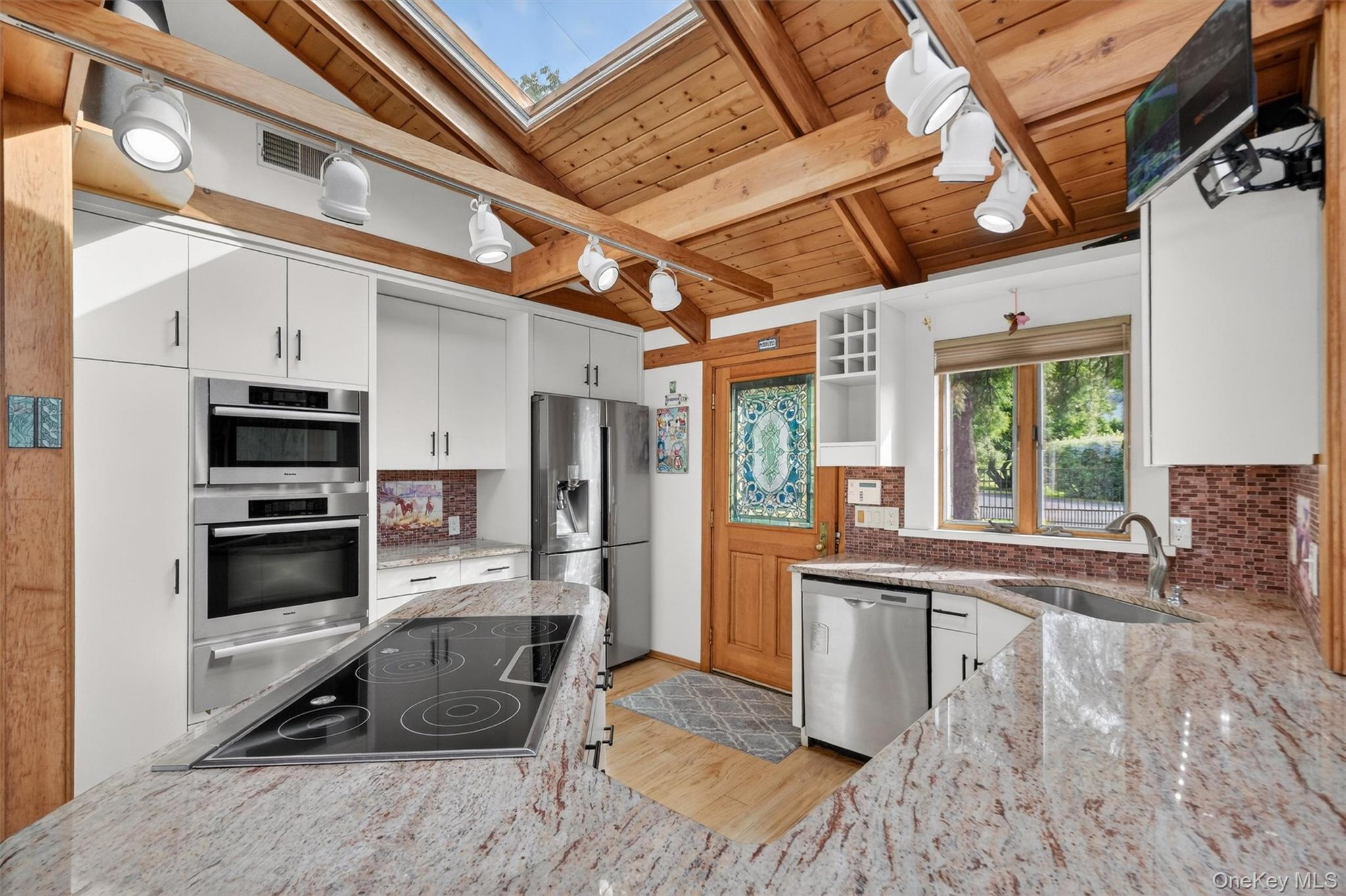 165 Hasbrouck Road Goshen, NY 10924 - Photo 18 of 50 Backdoor guests are best! Friends and family will enter through the open concept kitchen which features top tier appliances and skylights