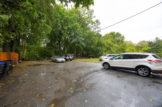 a view of street with parked cars