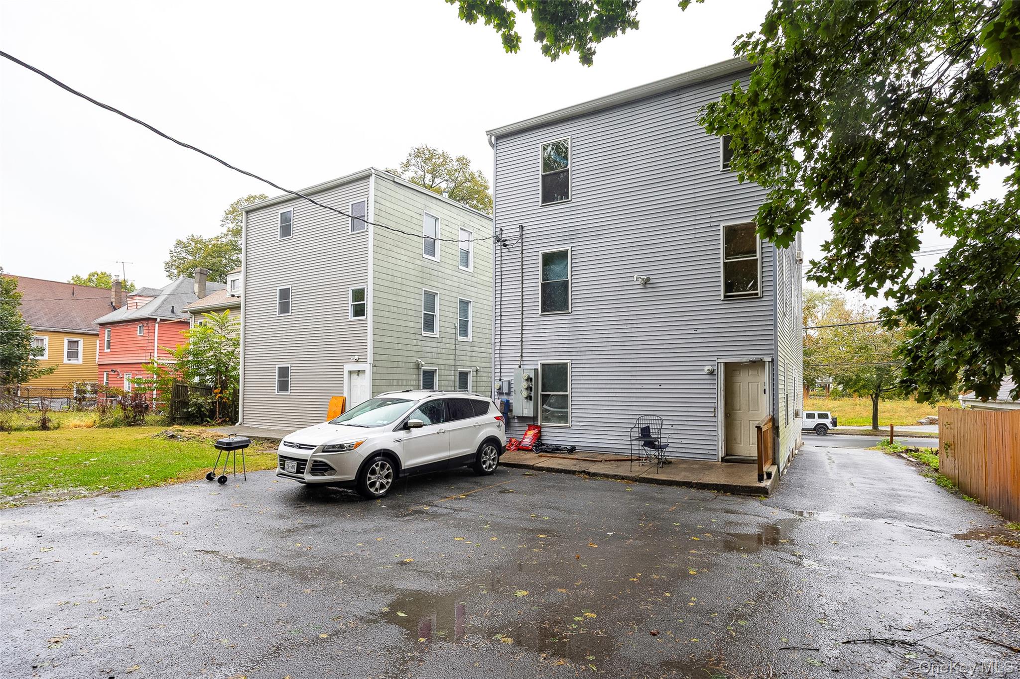 52 Parker Avenue Poughkeepsie, NY 12601 - Photo 10 of 12 a white car parked in front of a house