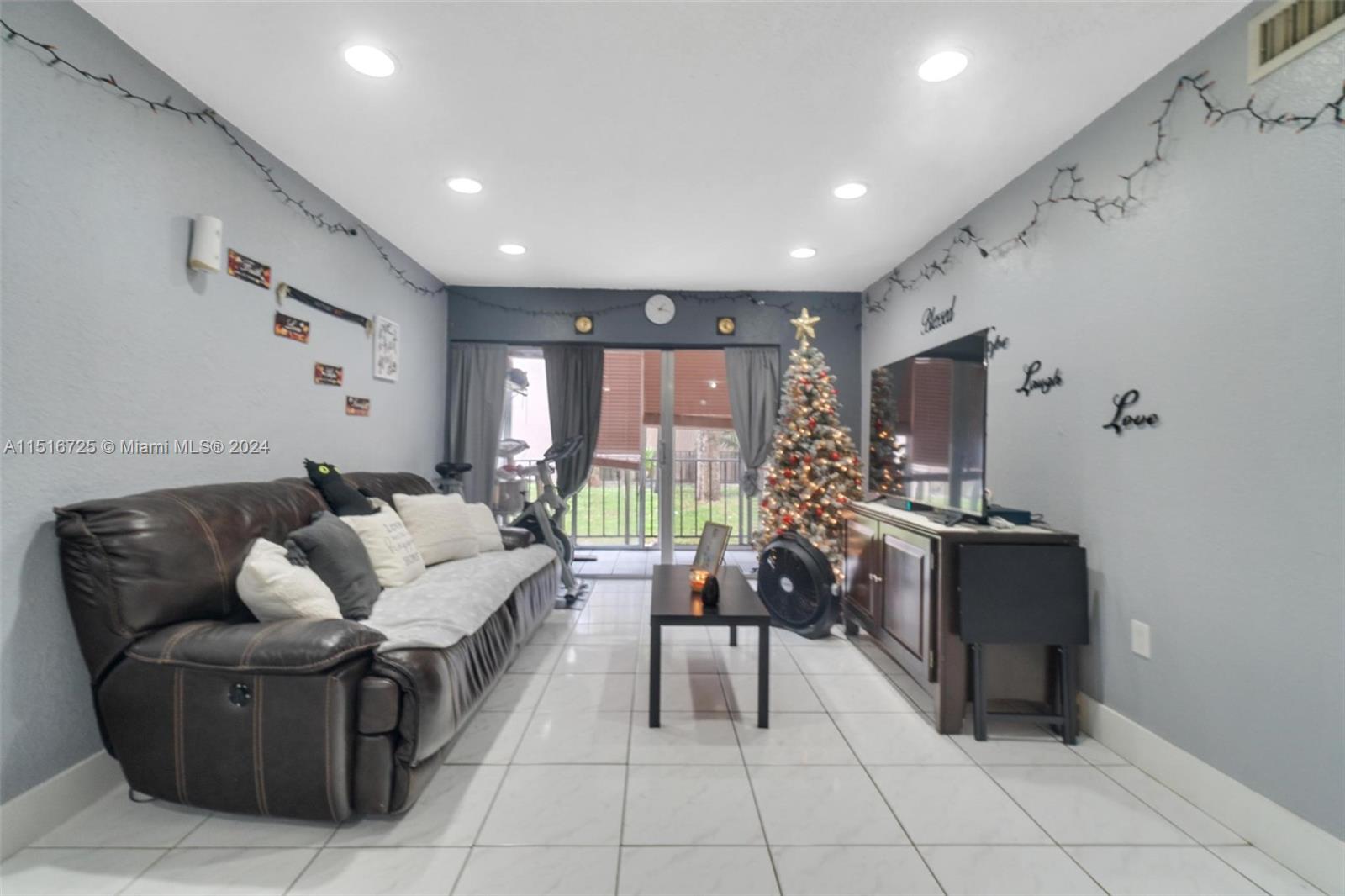 1900 West 68th Street, Unit E104 Hialeah, FL 33014 - Photo 13 of 31 a living room with furniture