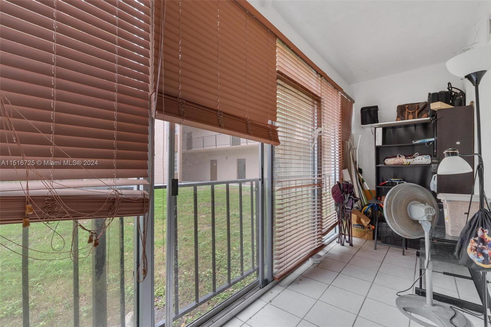 1900 West 68th Street, Unit E104 Hialeah, FL 33014 - Photo 16 of 31 a view of porch with seating space