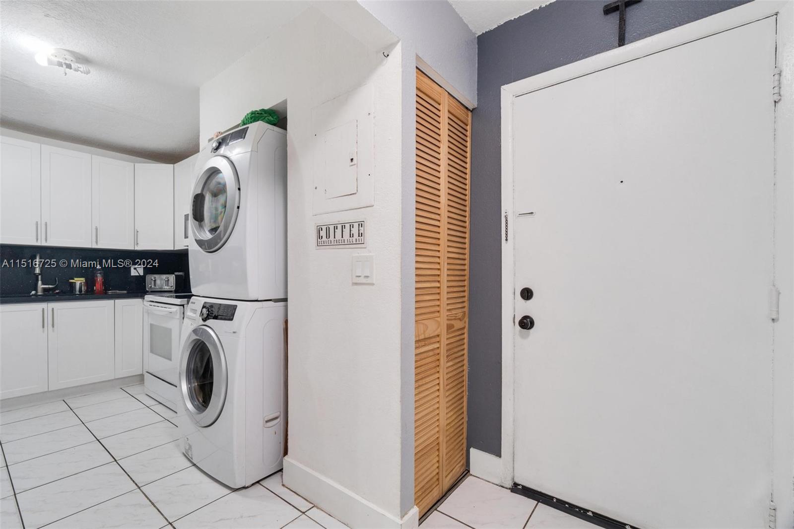1900 West 68th Street, Unit E104 Hialeah, FL 33014 - Photo 10 of 31 a utility room with dryer and washer