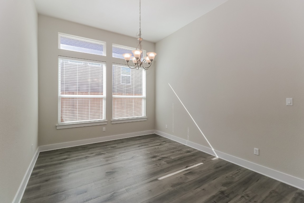 6101 Antelope Well Lane Austin, TX 78738 - Photo 6 of 36 a view of empty room with wooden floor and fan