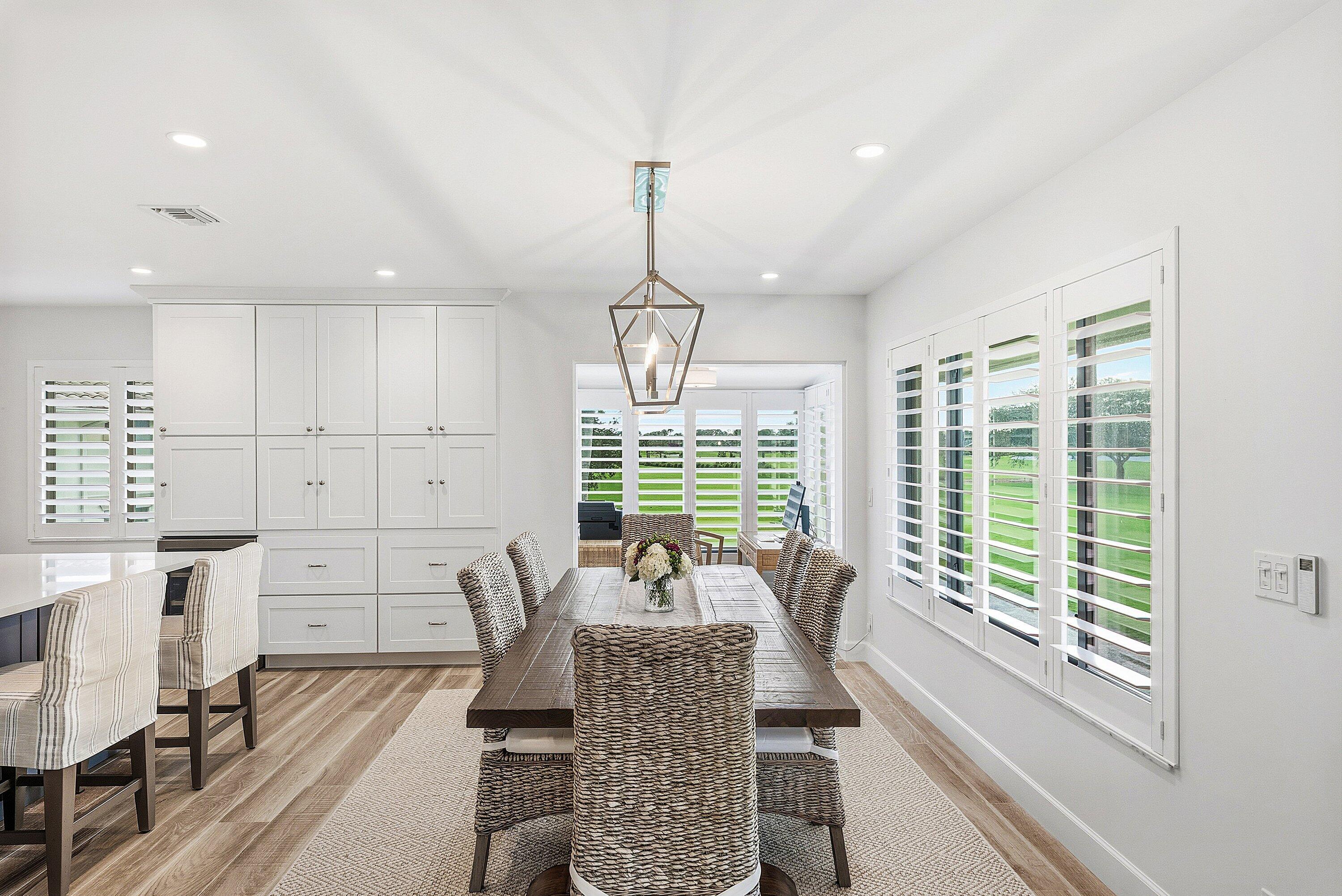 10157 Quail Covey Road, Unit HIBISCUS N Boynton Beach, FL 33436 - Photo 12 of 52 a view of a dining room with furniture window and outside view