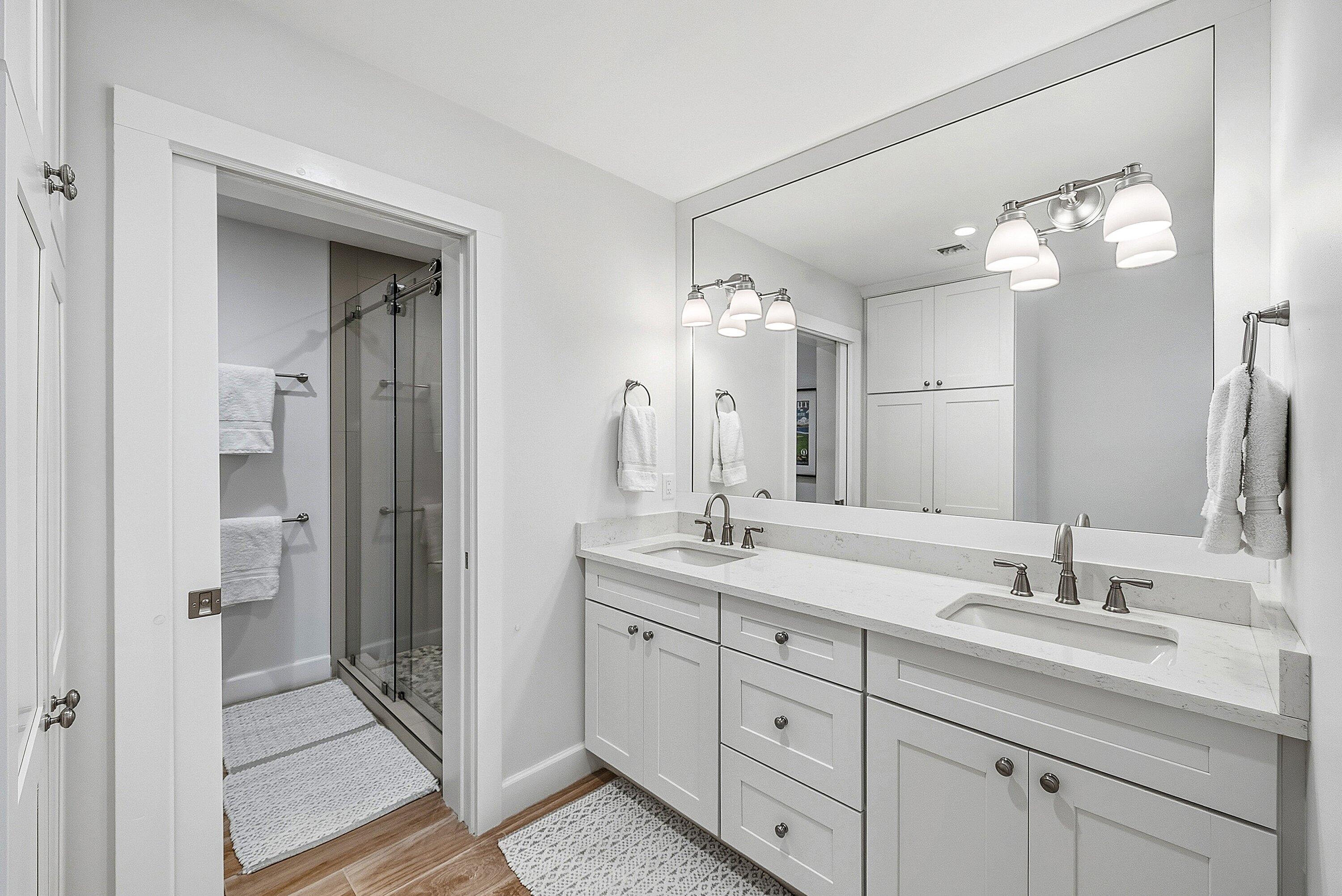 10157 Quail Covey Road, Unit HIBISCUS N Boynton Beach, FL 33436 - Photo 23 of 52 a bathroom with a double vanity sink mirror and next to a window
