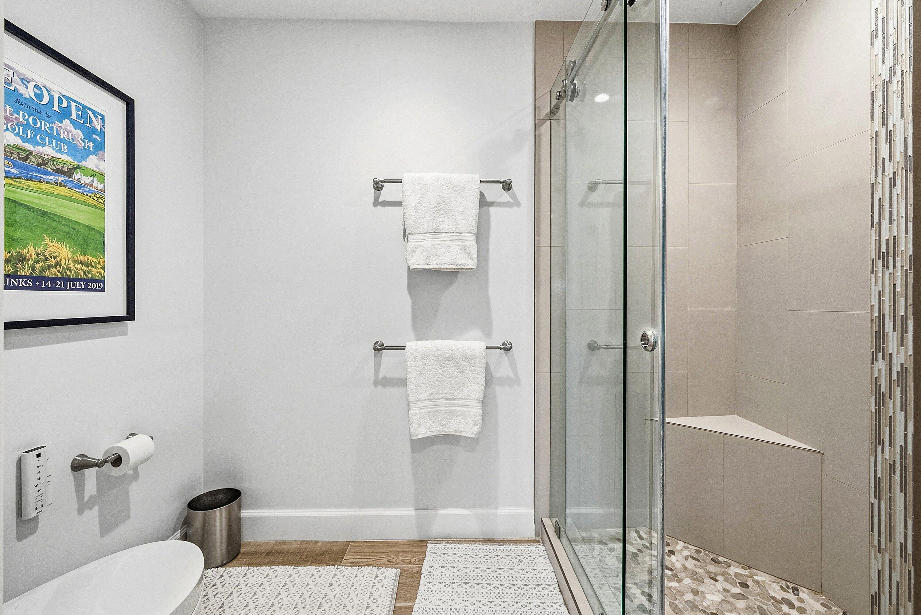 10157 Quail Covey Road, Unit HIBISCUS N Boynton Beach, FL 33436 - Photo 24 of 52 a bathroom with a shower and toilet
