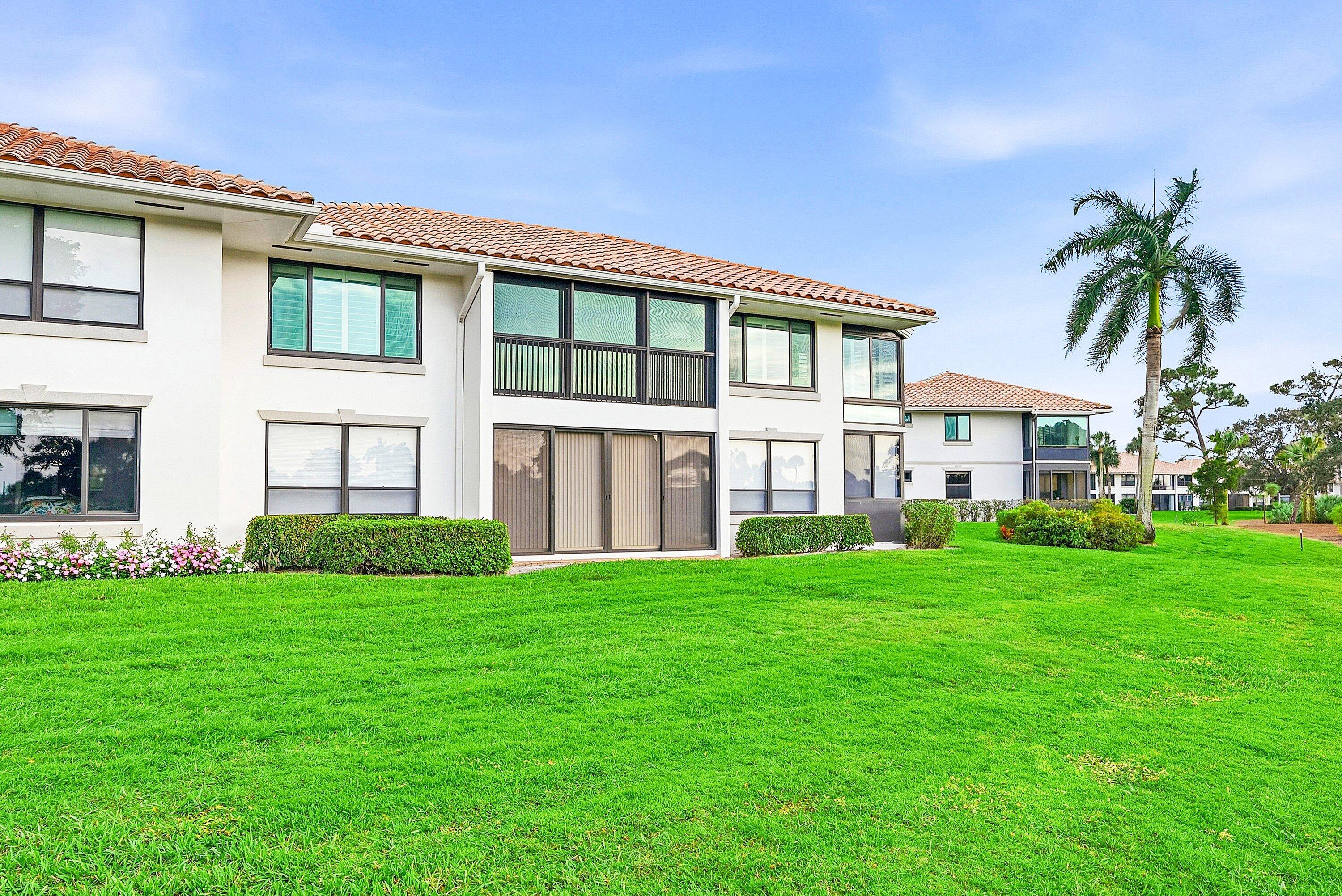 10157 Quail Covey Road, Unit HIBISCUS N Boynton Beach, FL 33436 - Photo 29 of 52 a view of a yard in front of a house
