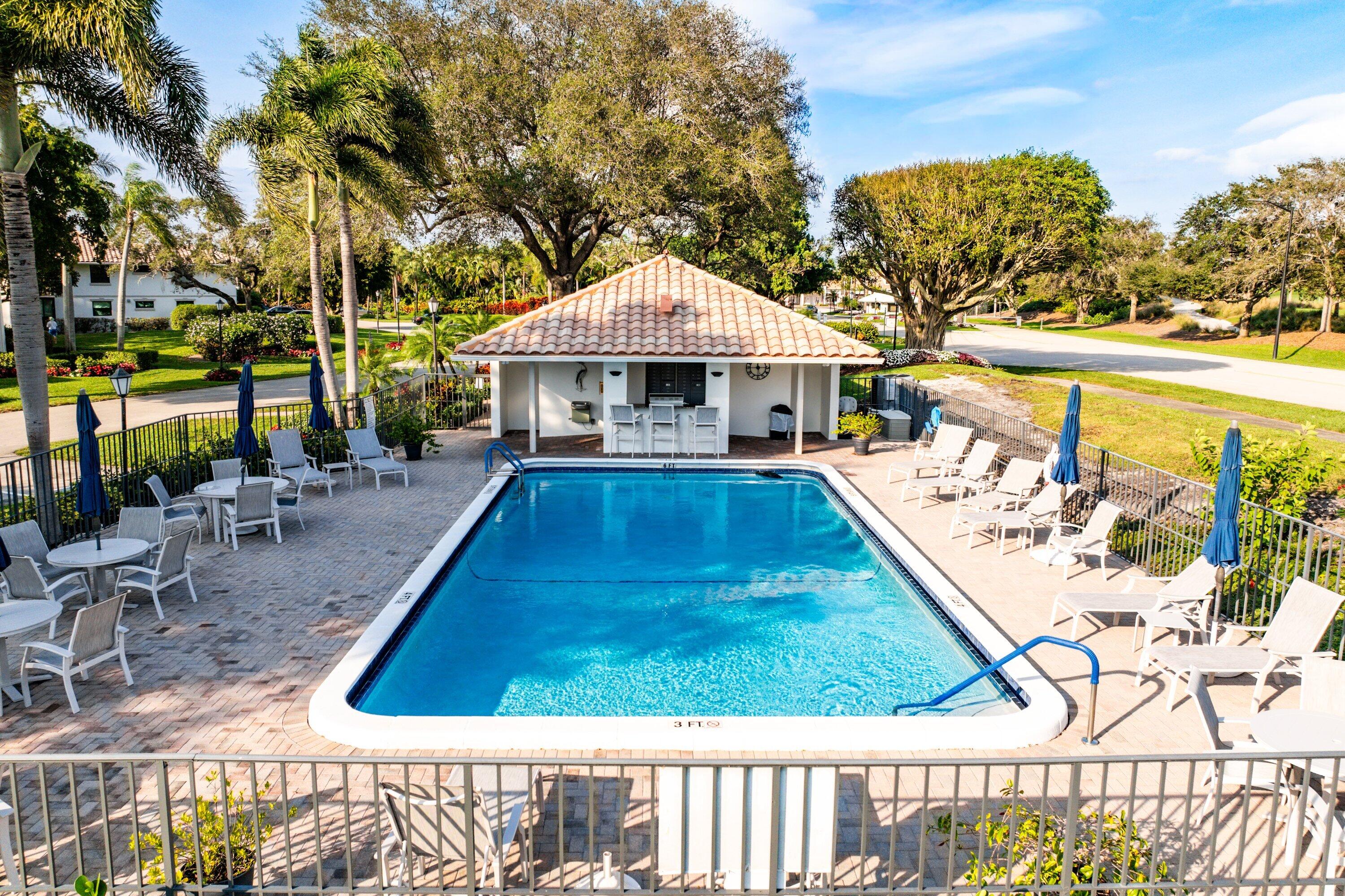 10157 Quail Covey Road, Unit HIBISCUS N Boynton Beach, FL 33436 - Photo 30 of 52 swimming pool view with a seating space