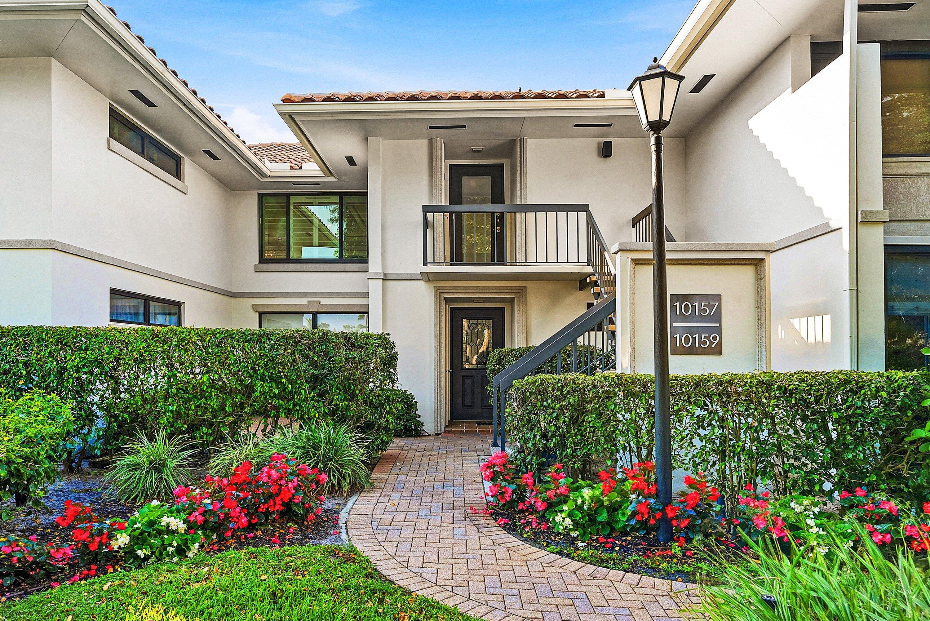10157 Quail Covey Road, Unit HIBISCUS N Boynton Beach, FL 33436 - Photo 42 of 52 a house view with a garden space