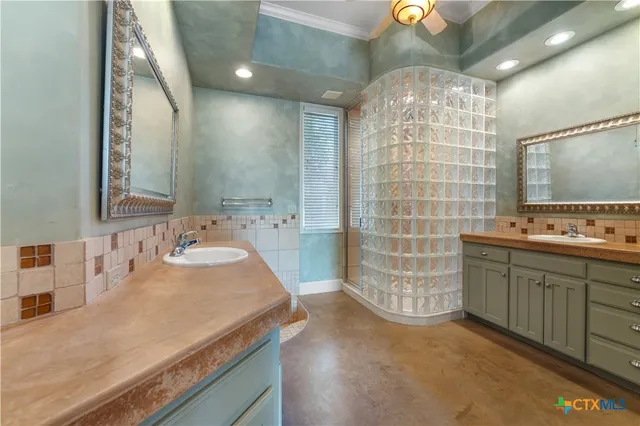 a bathroom with a sink double vanity and a mirror