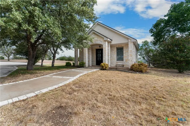 a house with trees in the background