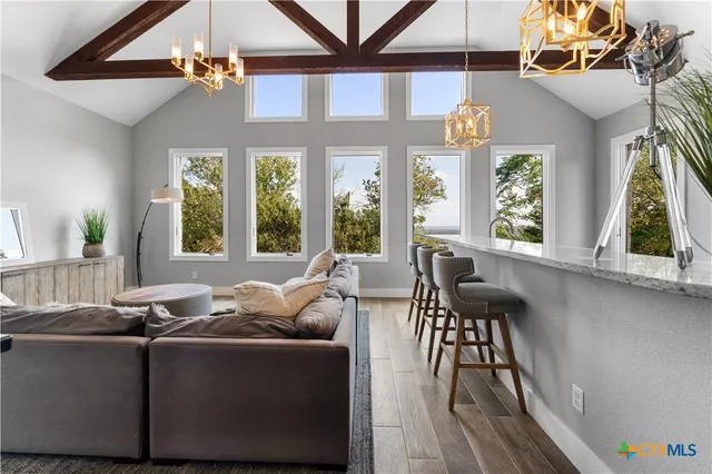 a living room with furniture and a large window