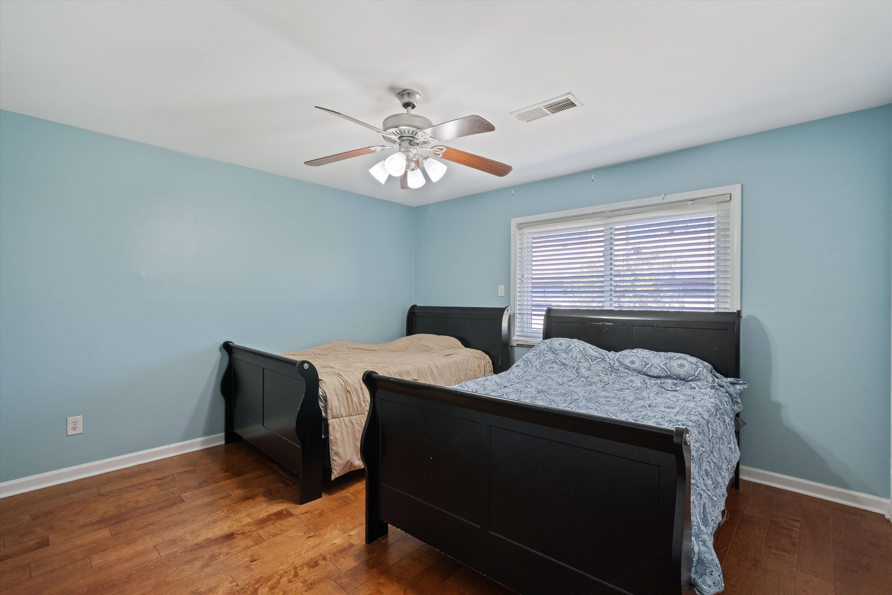 1838 Fernspring Cove, Unit 36 Germantown, TN 38138 - Photo 16 of 21 a bedroom with a bed and a chandelier