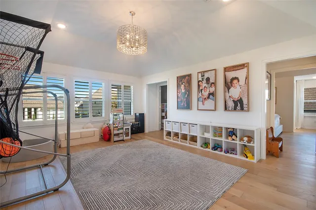 a view of a livingroom with furniture a projector and furniture