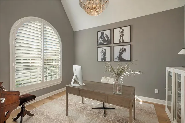 a view of a room with furniture and a window