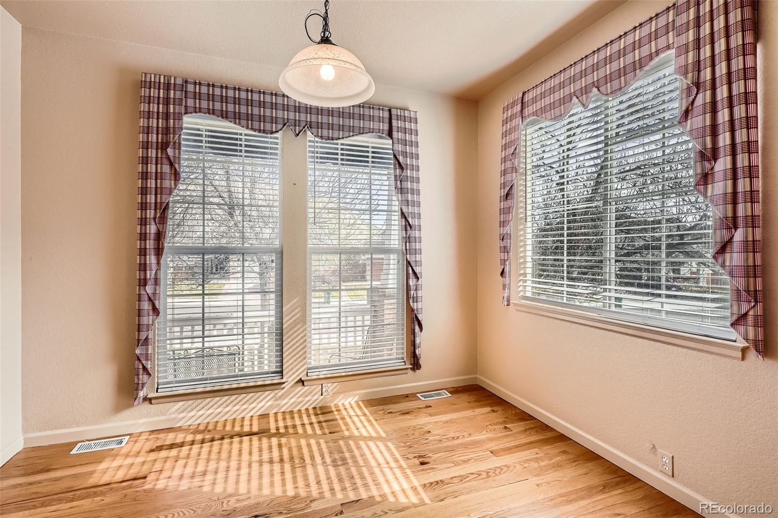1978 Granger Circle Castle Rock, CO 80109 - Photo 11 of 31 a view of an empty room with a window and wooden floor
