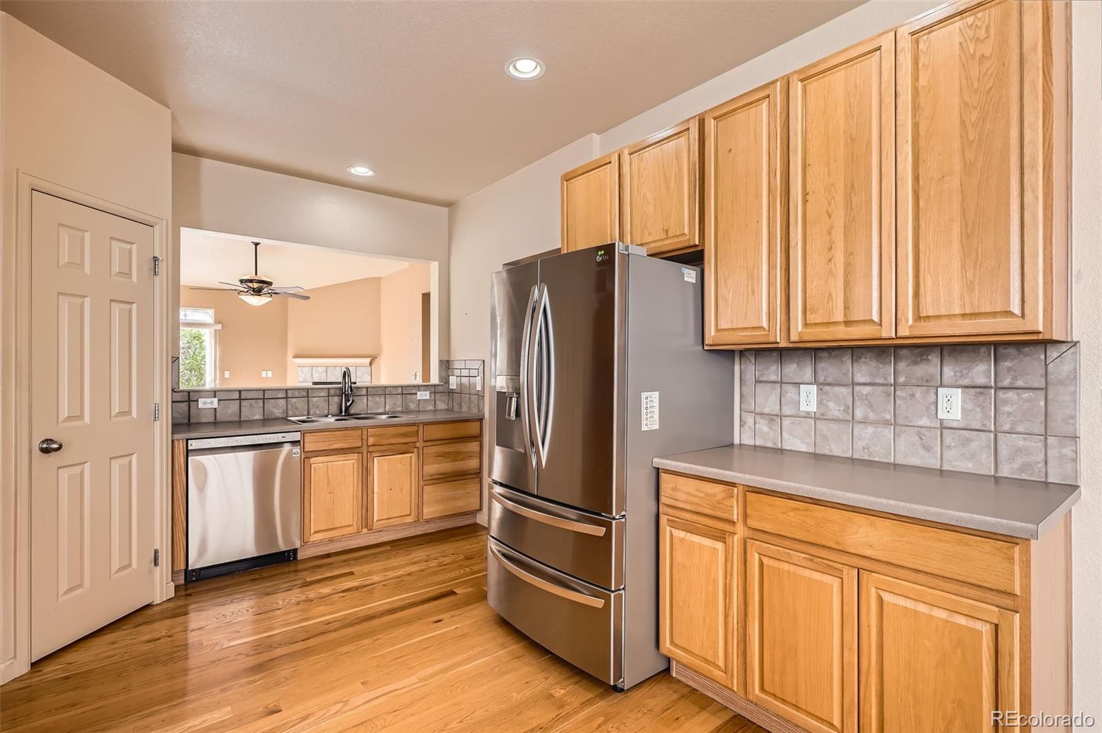 1978 Granger Circle Castle Rock, CO 80109 - Photo 13 of 31 a kitchen with stainless steel appliances granite countertop a refrigerator and cabinets